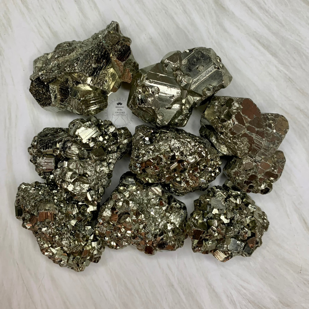 Collection of pyrite crystals on a white background