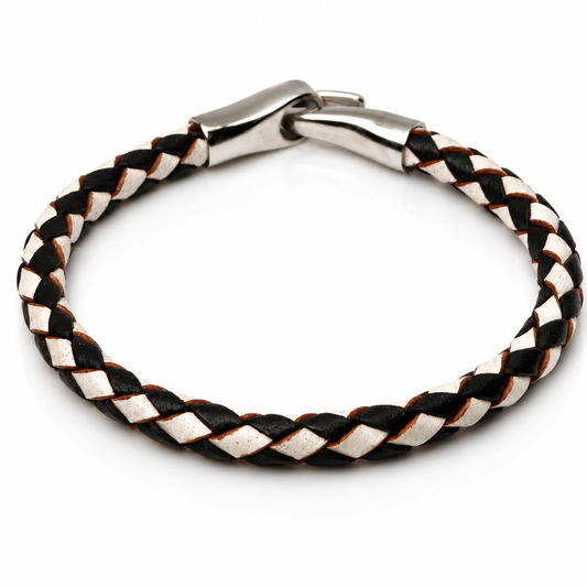 A braided leather bracelet with alternating black and white leather strands, featuring a polished silver-toned metal clasp, shown on a plain white background.