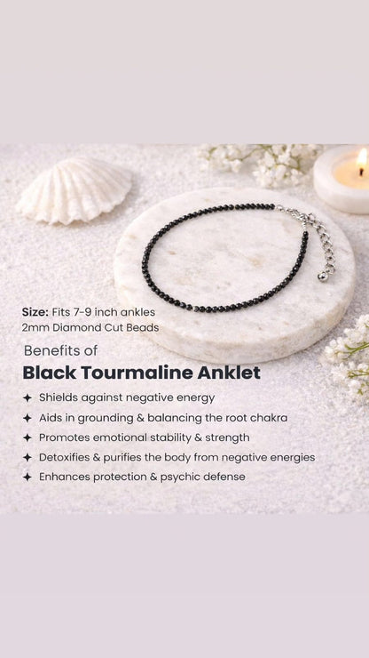 Black tourmaline anklet on a white surface with shell and candle decorations, featuring product details and benefits.