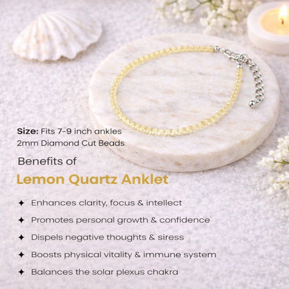 Lemon Quartz Anklet on a marble surface with shell and flower decorations