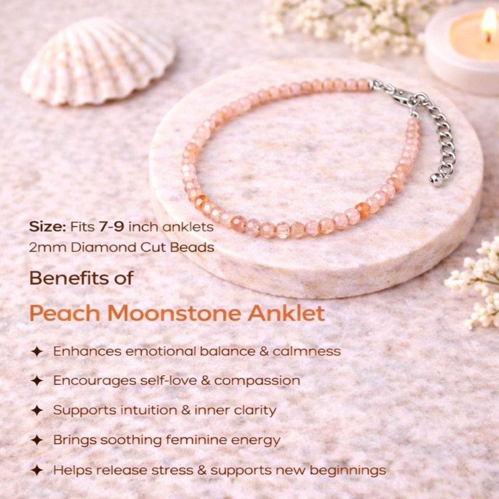Peach Moonstone anklet on a stone surface with shell and candle in the background