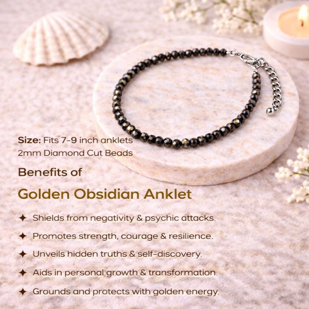 Golden Obsidian anklet on a stone surface with shell and candle in the background