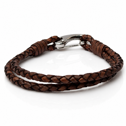 A double-strand brown braided leather bracelet with a silver-toned lobster clasp, displayed on a clean white background.
