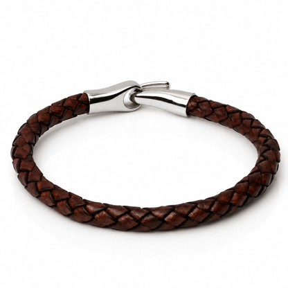 A brown braided leather bracelet with a polished silver-toned metal clasp, shown on a clean white background.