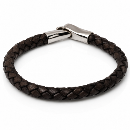 A dark brown braided leather bracelet with a polished silver-tone metal clasp, shown on a clean white background.