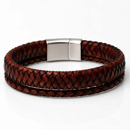 A double-strand braided brown leather bracelet with a polished silver-tone rectangular clasp, displayed on a clean white background.