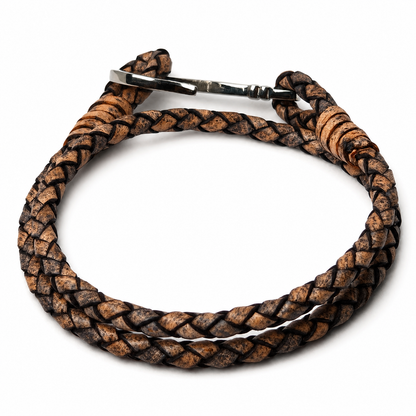 A braided leather accessory with a silver metal clasp, shown on a plain white background.